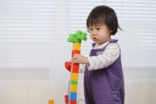 Child playing with lego blocks